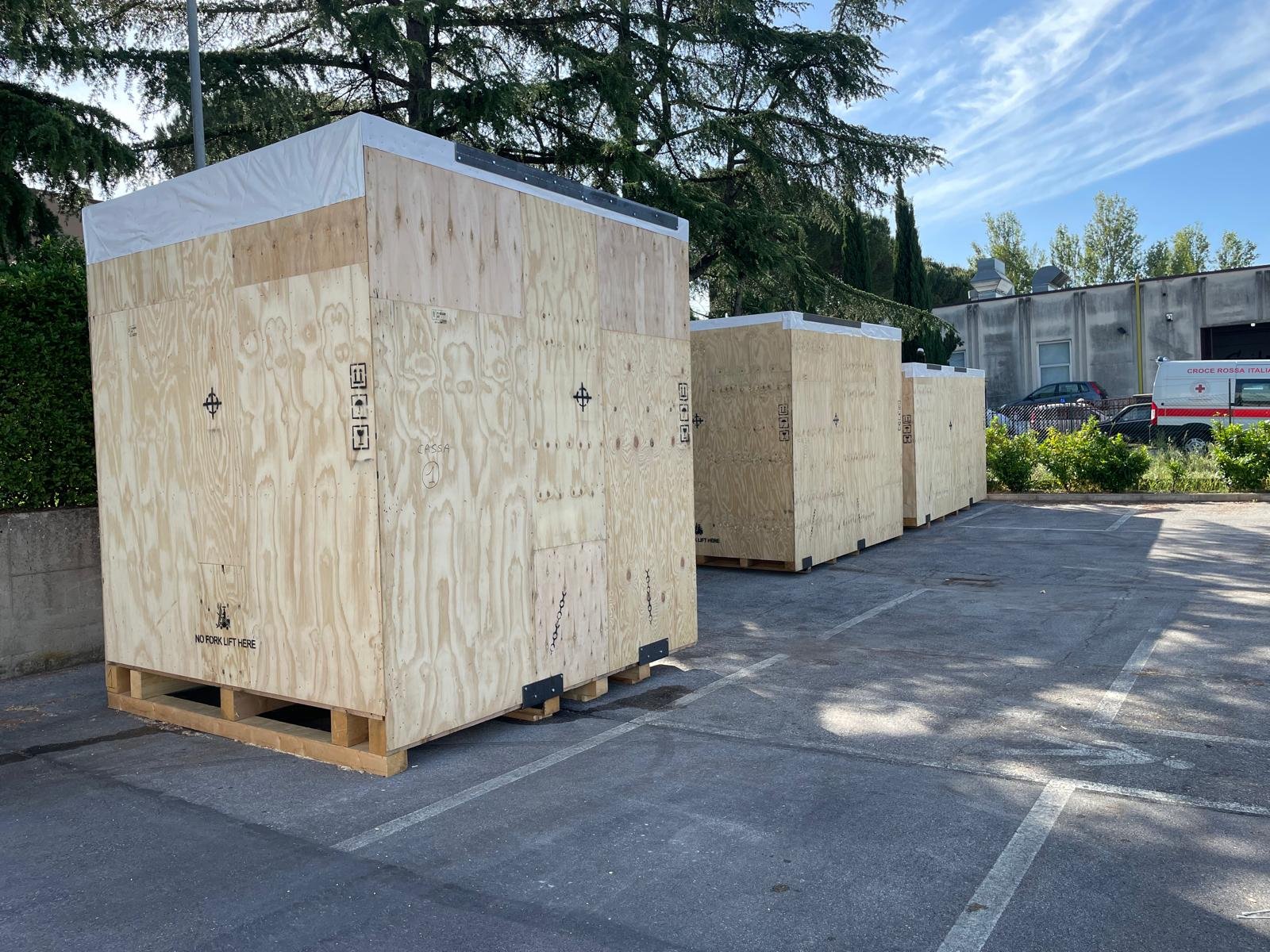 BOBST MASTERCUT 145 PER components packed in wooden crates for transport